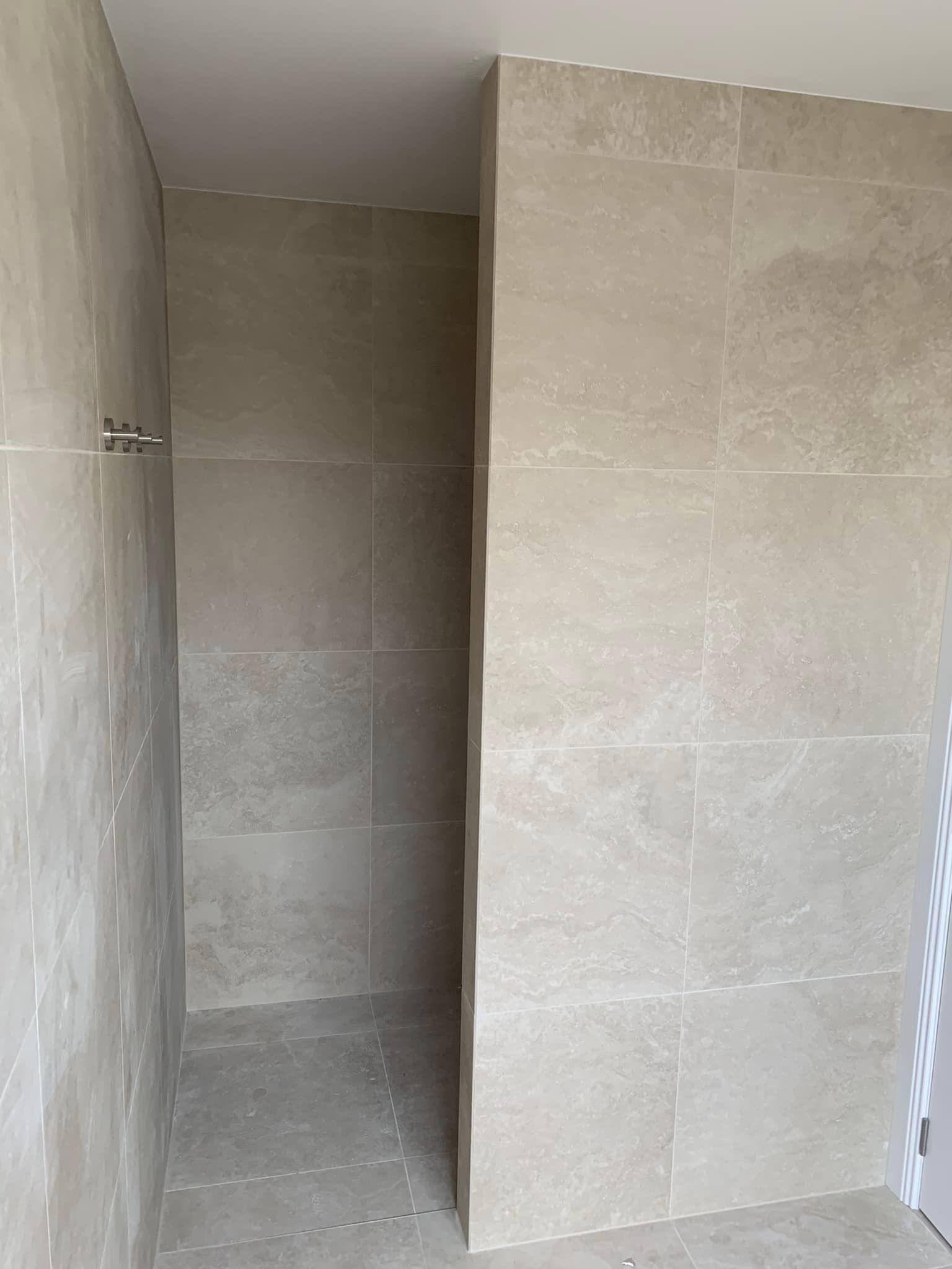 walk in shower tiling completed with floor to ceiling tiles